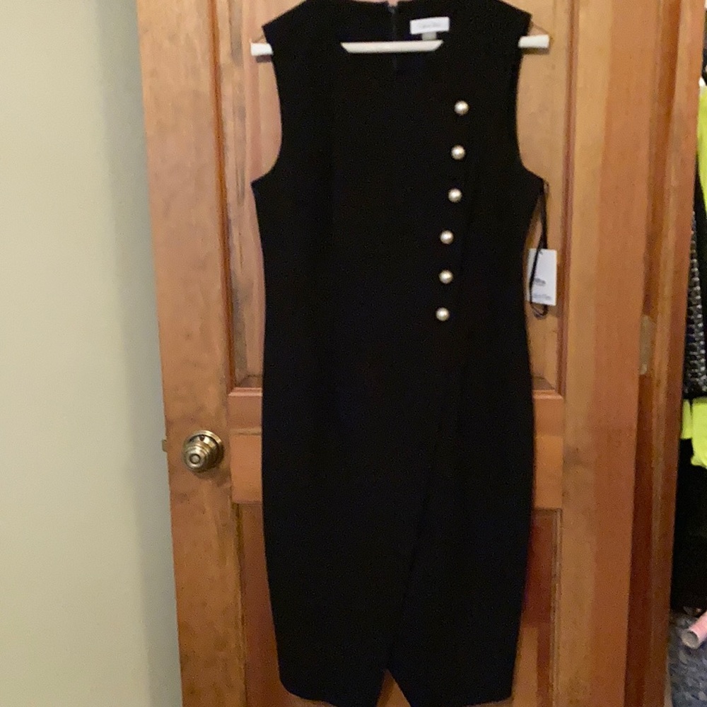 Calvin Klein sleeveless dress cross front with six  button front detail lined.